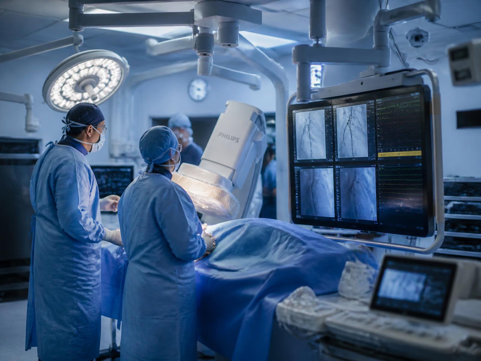 Clinical team using advanced imaging technology in a modern operating theatre